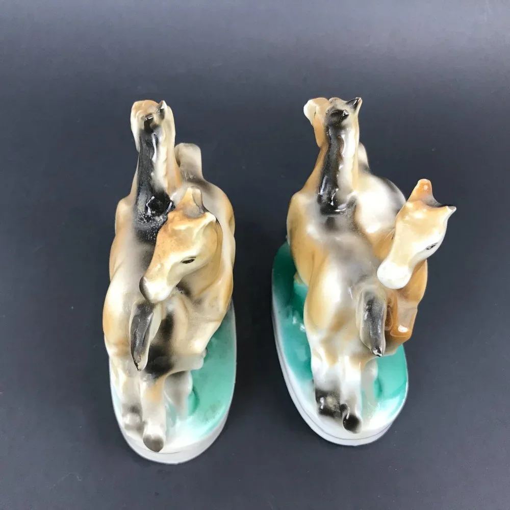 Two small antique horse figurines marked occupied Japan